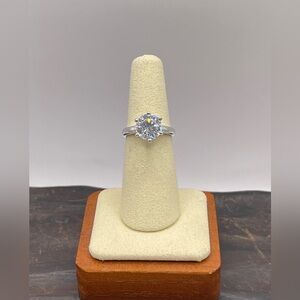 Two (2) carat cz solitaire in a 925 sterling silver setting. Size 6.25.